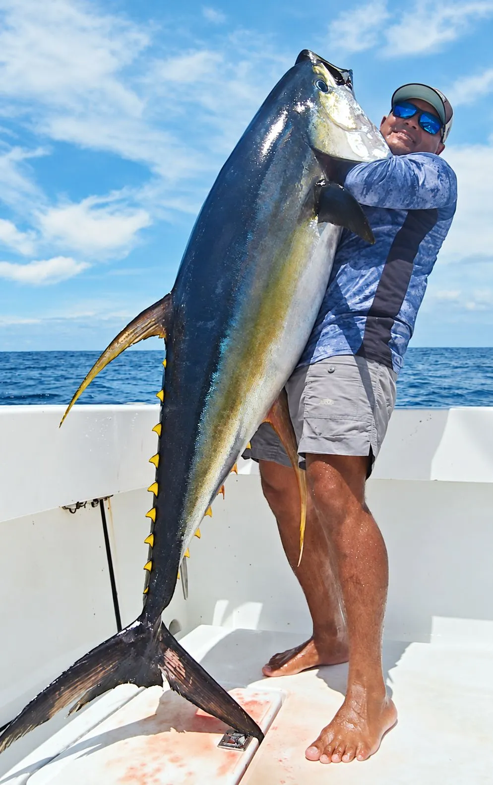 Alex Moreno with a yellowfin tuna on deck