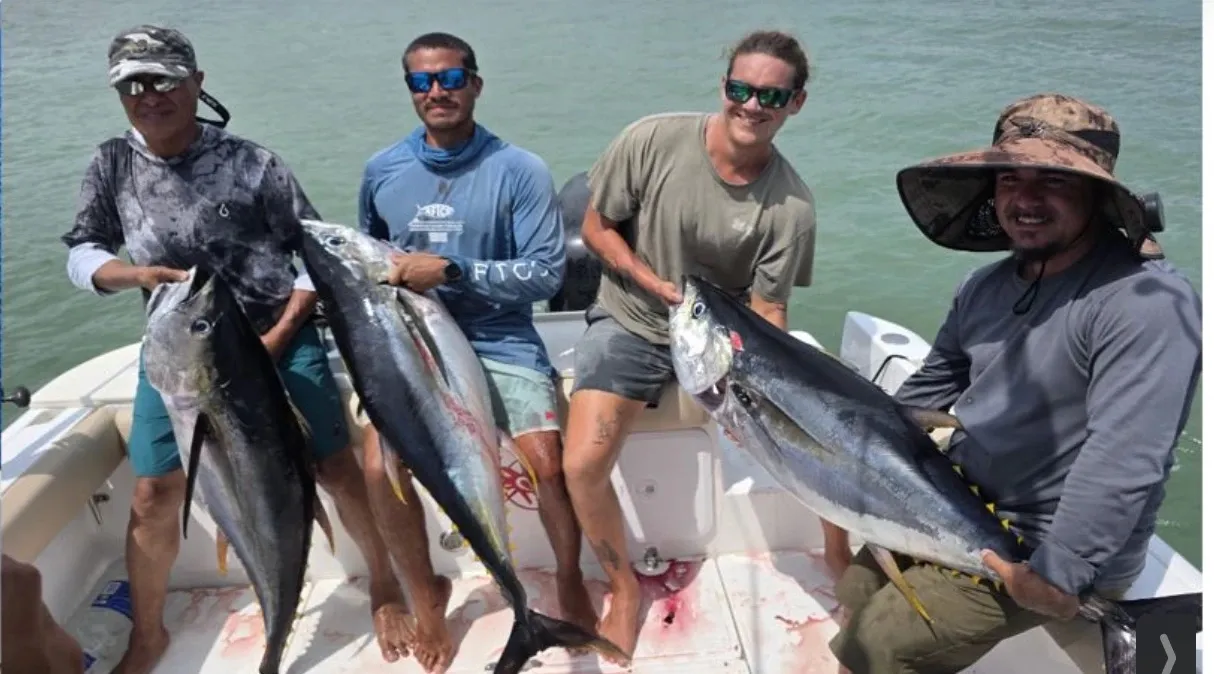 A group of anglers with yellowfin tuna aboard the boat off Playa Garza