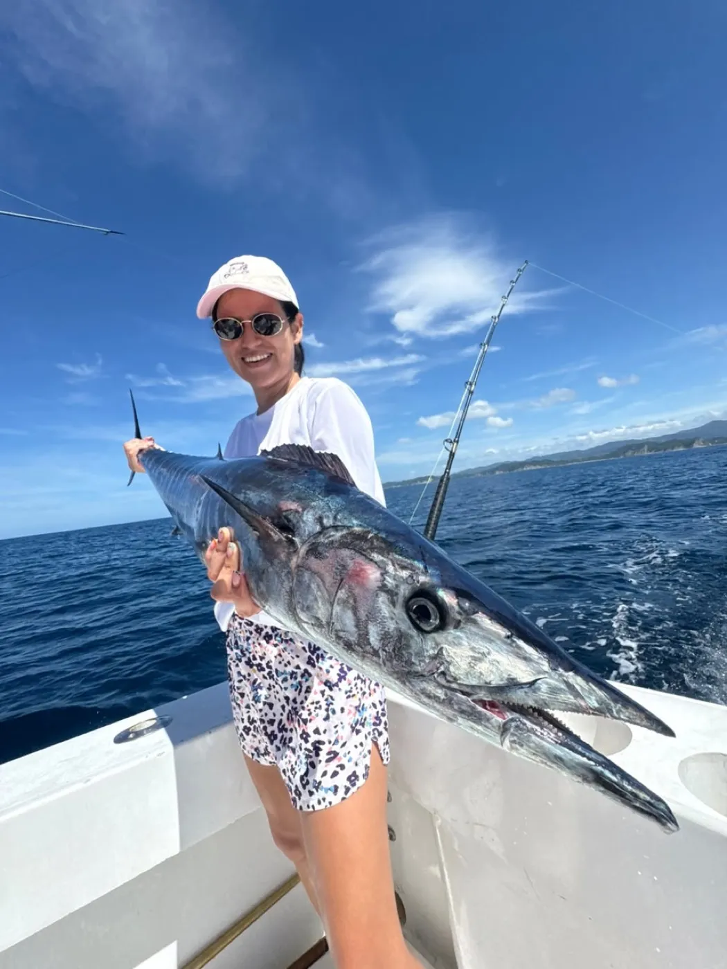 An angler holding a billfish off Playa Garza