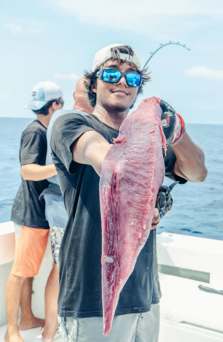 Danny Mora with a fresh cut of tuna on deck