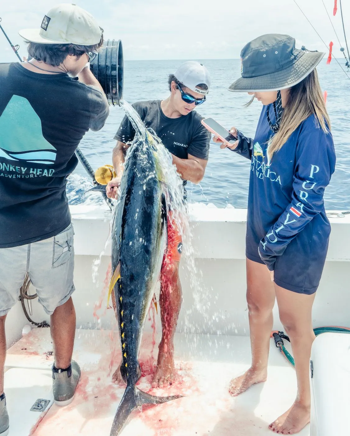 Dario Rodriguez with the crew and a yellowfin tuna