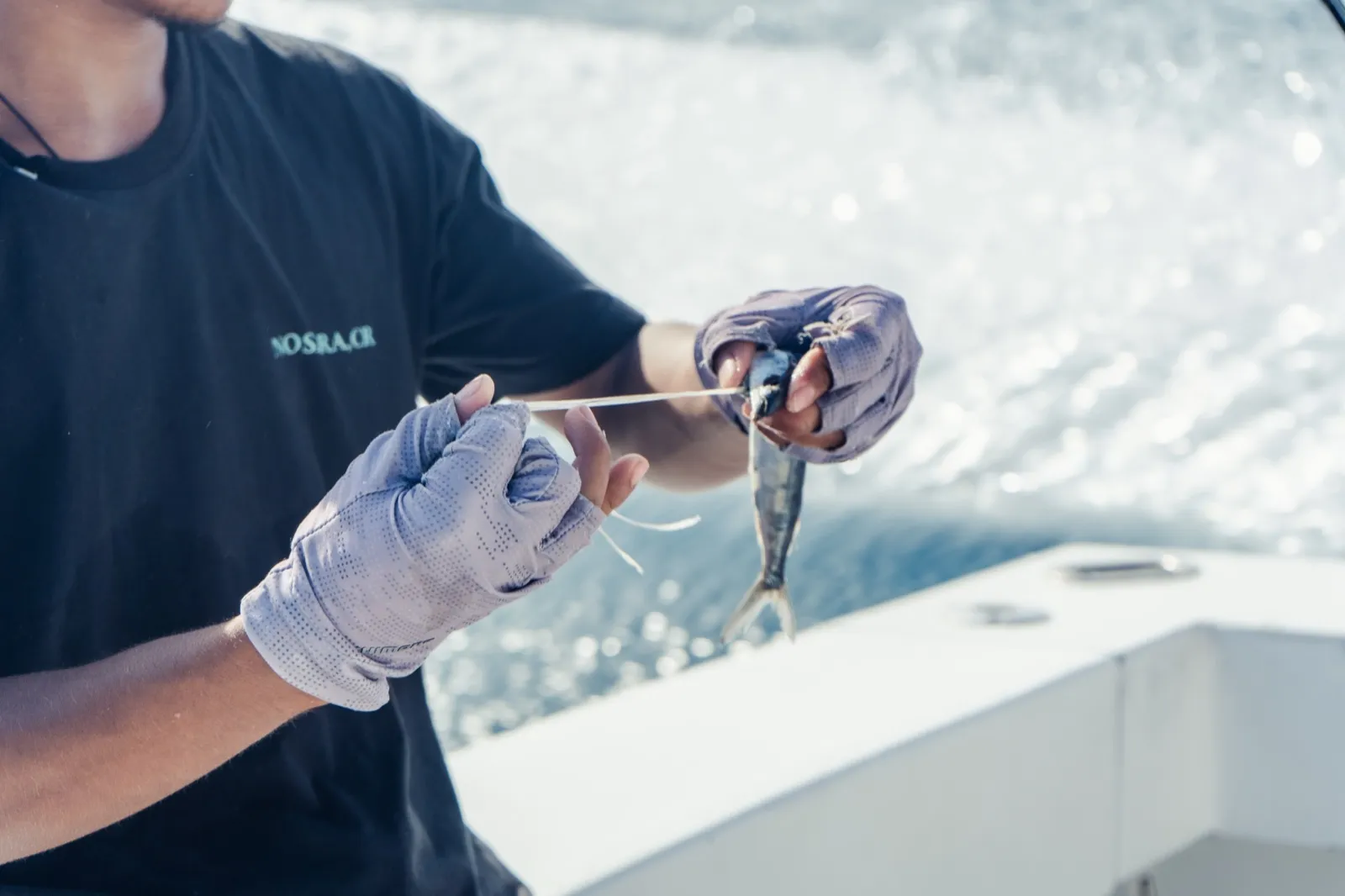 A Monkey Head crew member rigging bait on the boat off Playa Garza