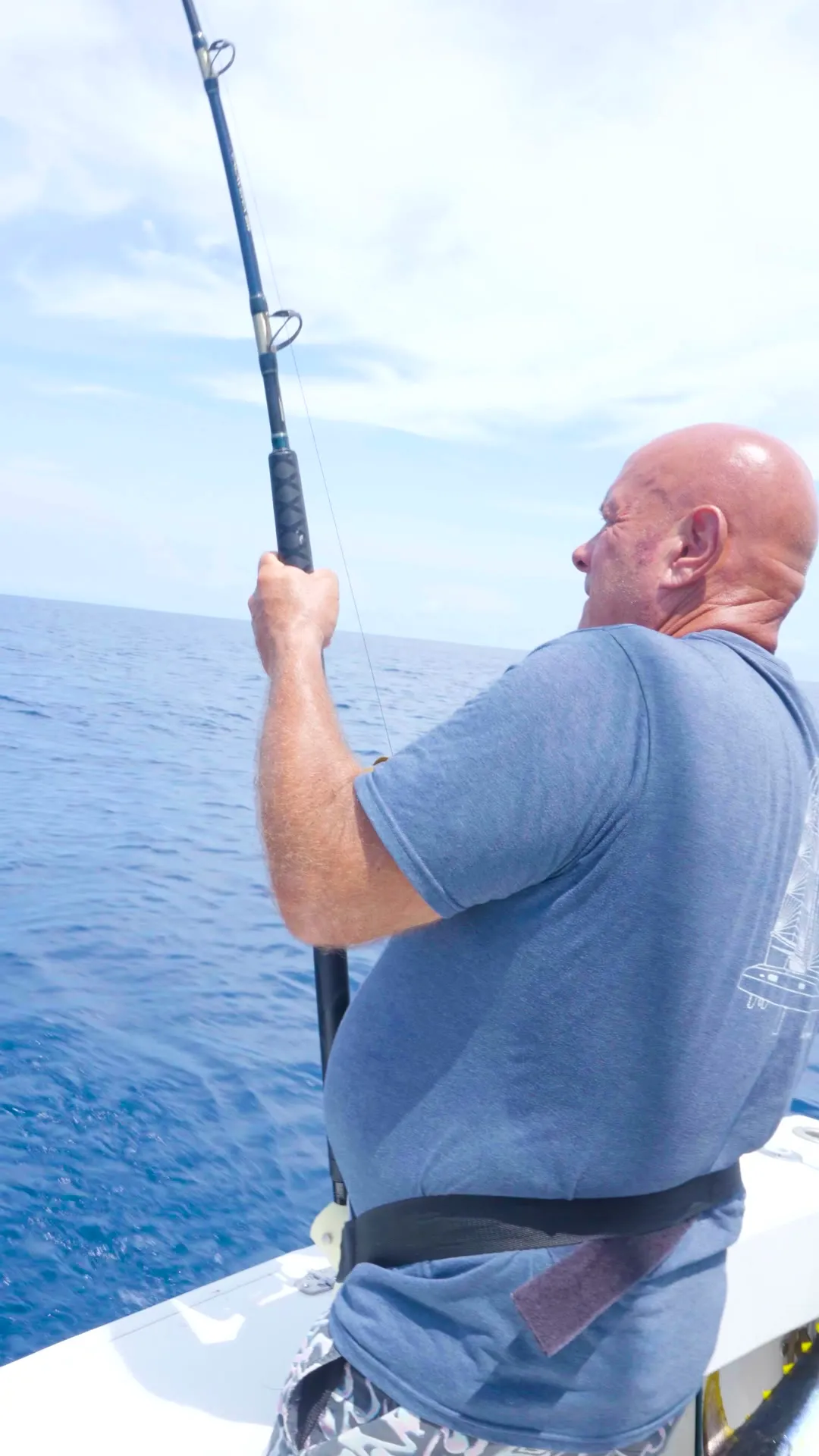 An angler fighting a fish aboard the Osprey off Playa Garza