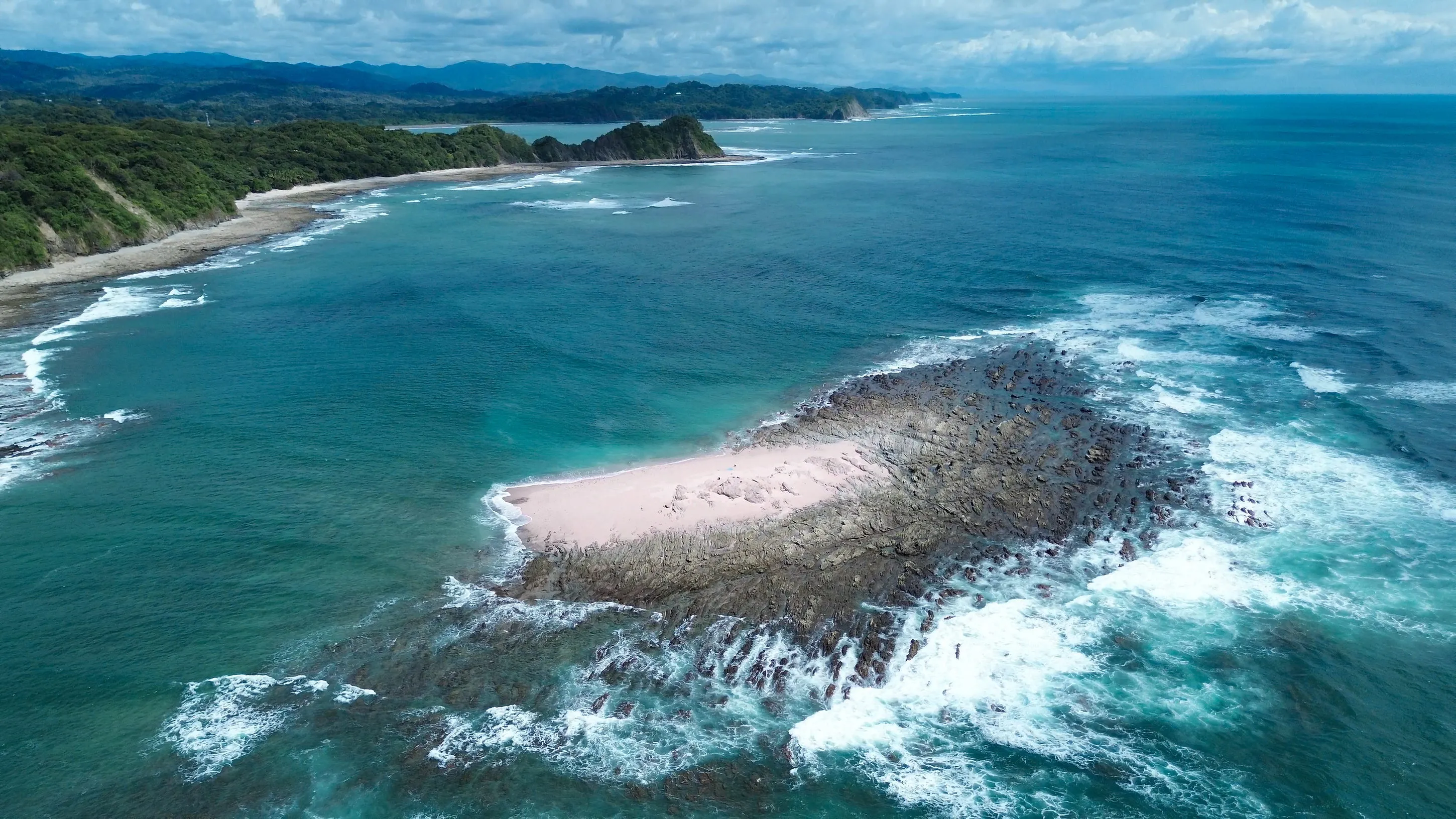 The rock stack and its shell beach from close in