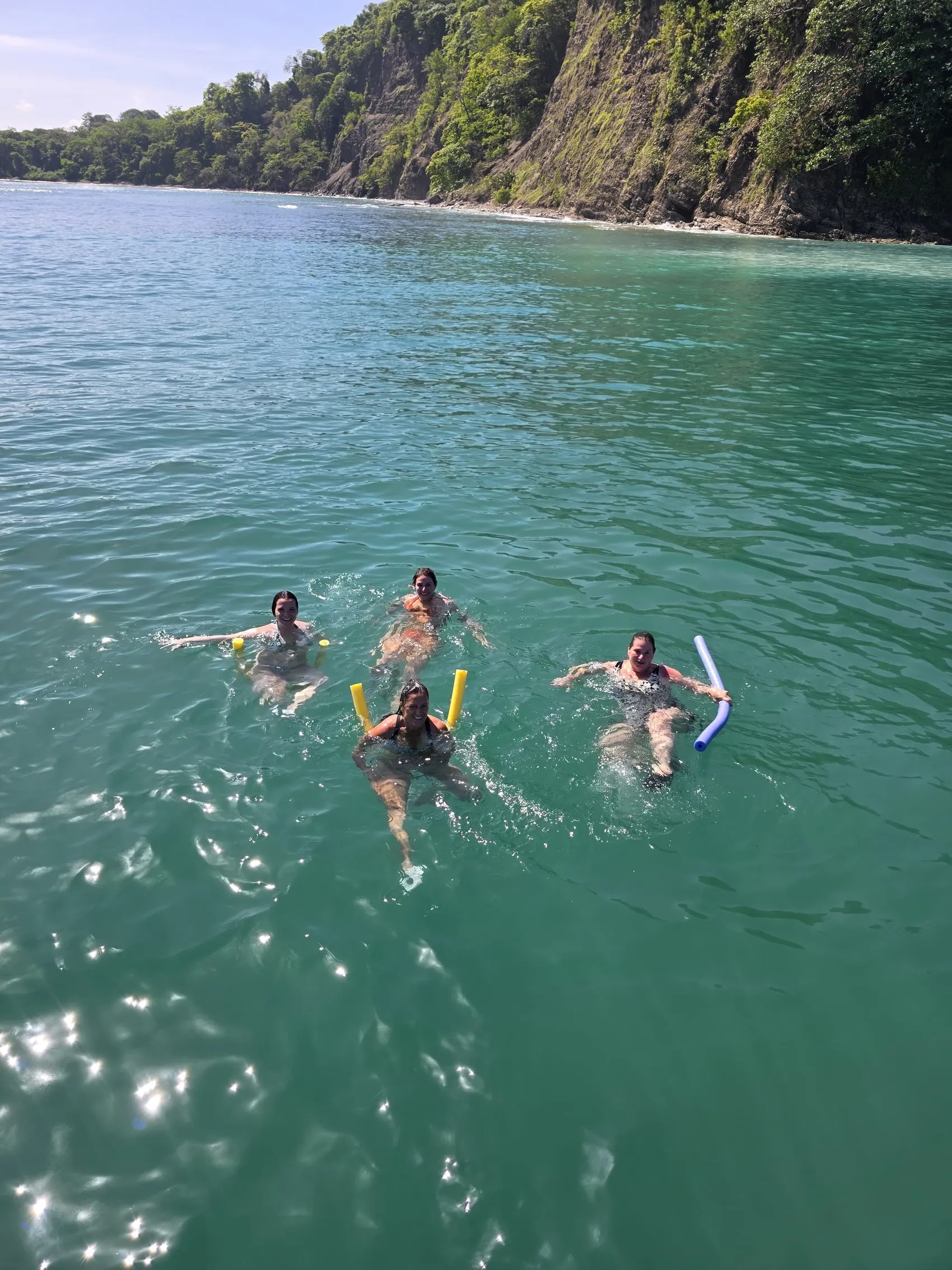 A group in the water at a snorkel stop