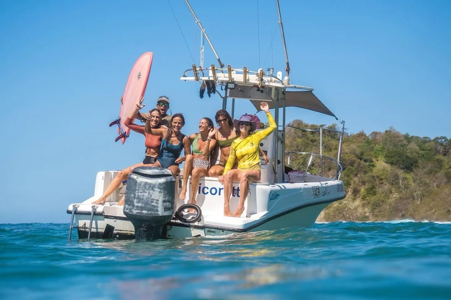 Six guests on the transom of the Ticorette